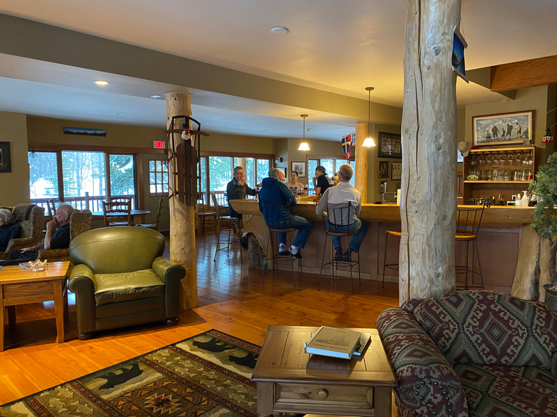 The bar area  at Vagabond lodge is dominated by a beautful douglas fir split log bar